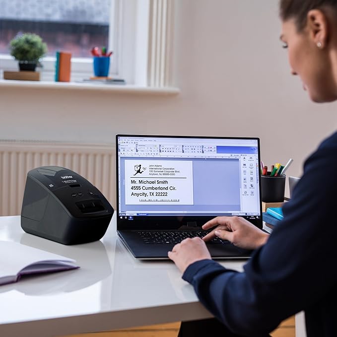 Brother QL-600 Desktop Monochrome Label Printer, up to 2.4" Label Width, No Ink Required, uses Brother Genuine DK Drop-in Rolls for Fast Labeling and Easy Integration with Microsoft Applications